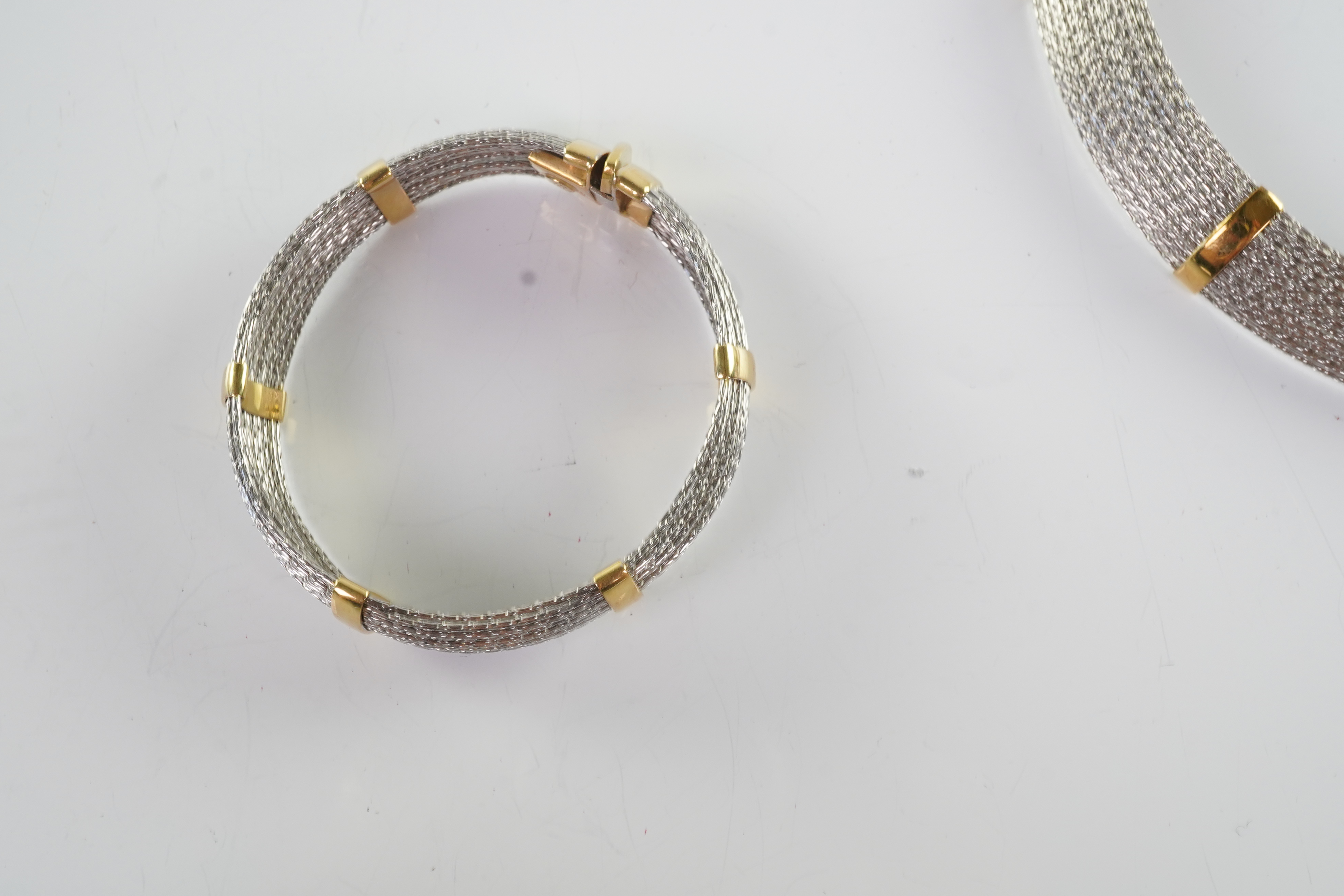 An 18ct gold collar and bangle